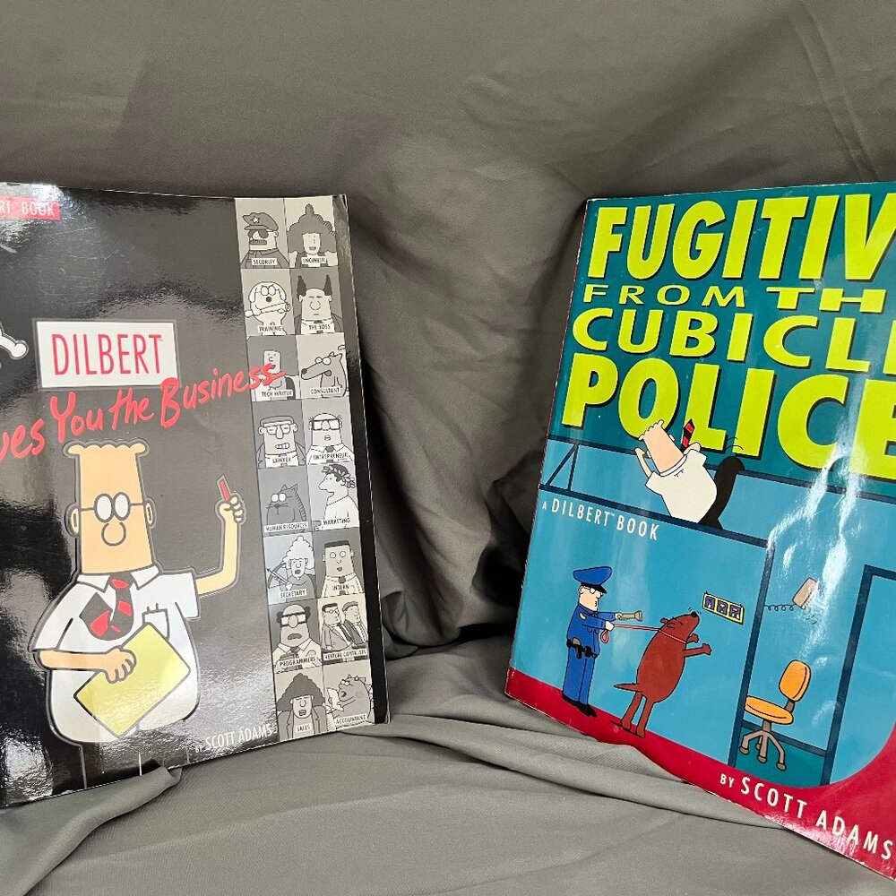 Dilbert "Gives you the business" and "Fugitive from the cubicle police" by SA
